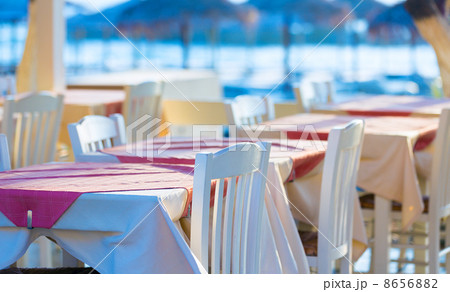 Street cafe tables on the coast, Santorini Greece 8656882