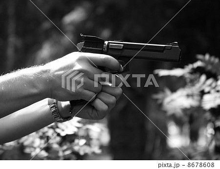 Pistol in a hand 8678608
