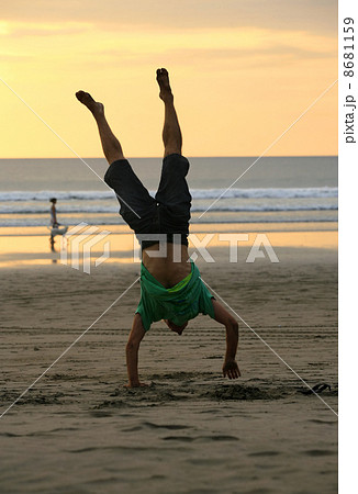 gymnast on a beach 8681159