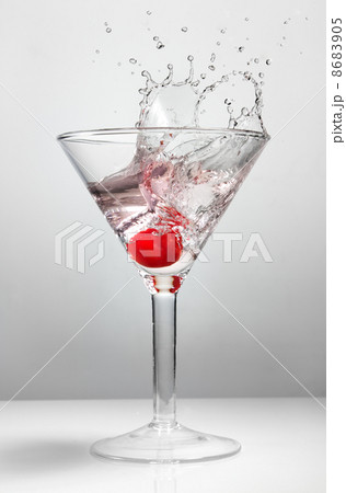 Splash of cherry in martini glass Splash of cherry in martini glass 8683905