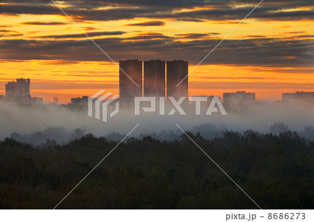 yellow sunrise under city in autumn 8686273