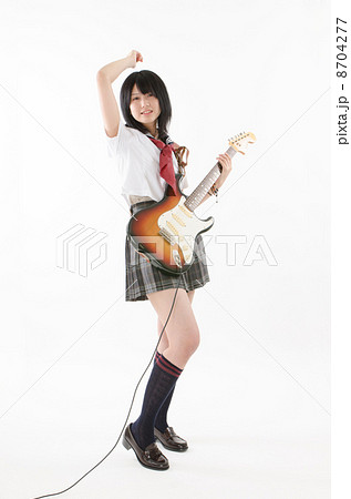 女子高生とエレキギターの写真素材