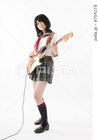 エレキギターを弾く女子高生の写真素材