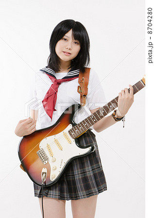 女子高生とエレキギターの写真素材