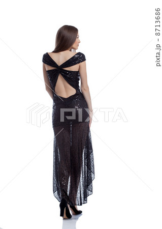 Hot woman in elegant dress posing back to camera Hot woman in elegant dress posing back to camera 8713686