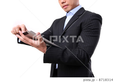 Businessman working on digital tablet Businessman working on digital tablet 8718314