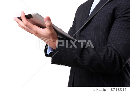 Businessman working on digital tablet 8718315