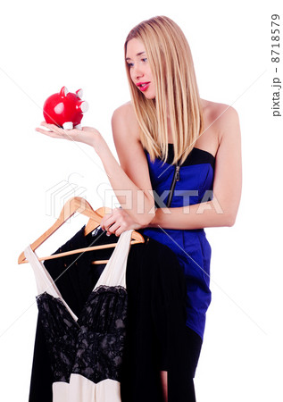 Woman thinking of spending her savings on clothing 8718579