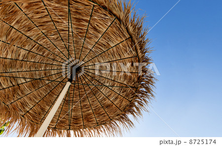 Beach umbrella on sky background Beach umbrella on sky background 8725174