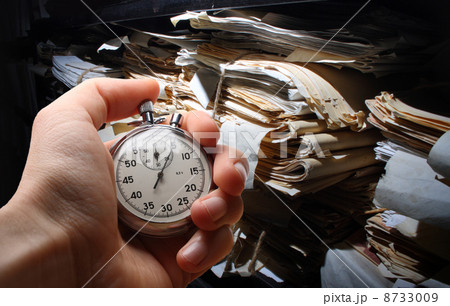 Paper documents stacked in archive 8733009