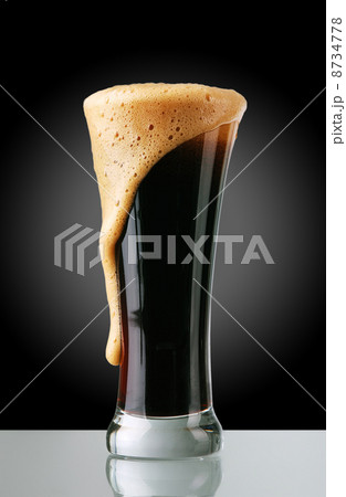 Glass of dark beer 8734778