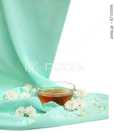 Glass tea cup and flowers 8735006