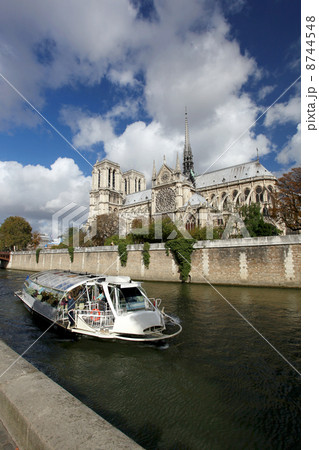 Notre Dame with boat on Seine in Paris, France Notre Dame with boat on Seine in Paris, France 8744548