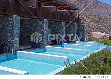 Summer resort with row of private swimming pools 8745154