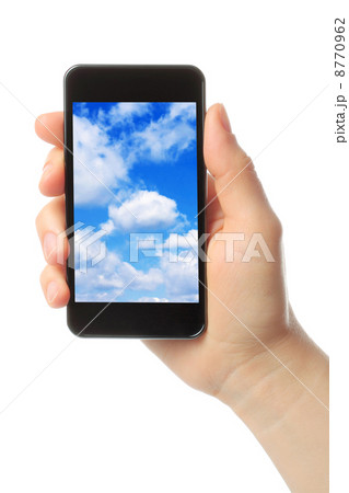Woman hand holds smart phone with sky . Woman hand holds smart phone with sky . 8770962
