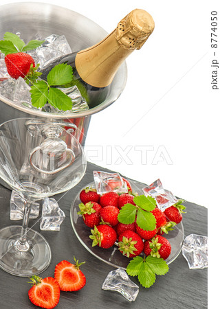 festive arrangement with bottle of champagne and strawberries 8774050
