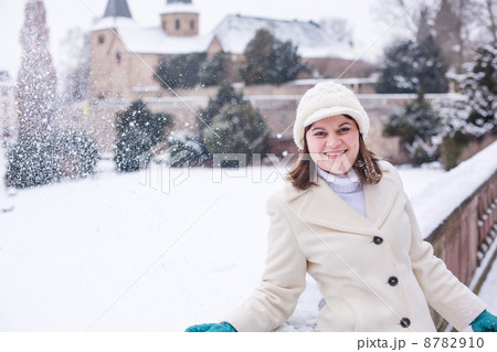 Young woman having fun with snow on winter day Young woman having fun with snow on winter day 8782910