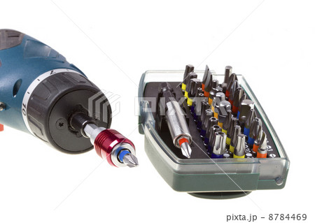 Drill-screwdriver electric storage and set of nozzles on white background Drill-screwdriver electric storage and set of nozzles on white background 8784469
