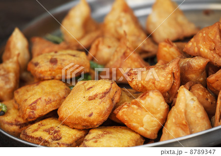 Traditional Indian dish samosa on the open market 8789347