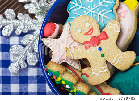 smiling on the background of Christmas gingerbread decorations 8789785