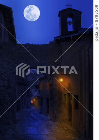 Night view of narrow street in small town. 8795509
