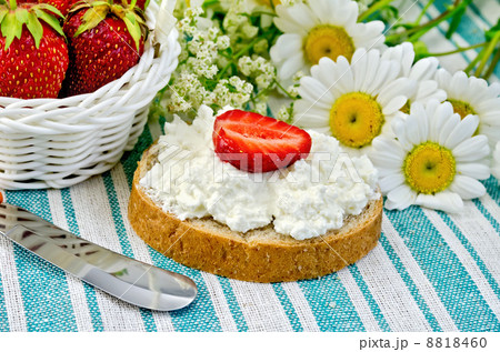 Bread with curd cream and strawberries on a green napkin Bread with curd cream and strawberries on a green napkin 8818460