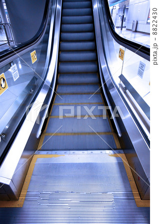 Moving escalator in a subway station Moving escalator in a subway station 8822430