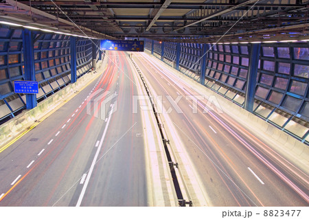 Traffic in tunnel in Hong Kong at night Traffic in tunnel in Hong Kong at night 8823477