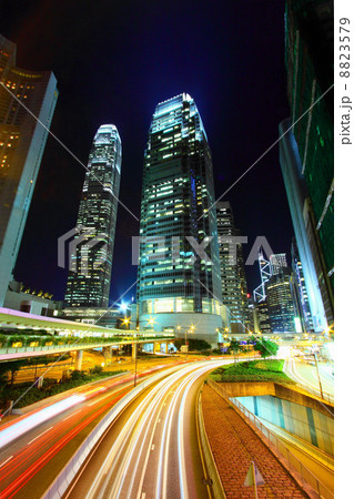Traffic in city at night, it shows the busy business environment Traffic in city at night, it shows the busy business environment 8823579