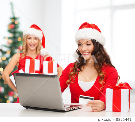 women with gift, laptop computer and credit card 8835441