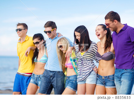 group of friends having fun on the beach 8835633