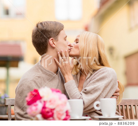 romantic happy couple kissing in the cafe romantic happy couple kissing in the cafe 8836209
