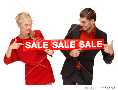 woman and man with red sale sign woman and man with red sale sign 8836342