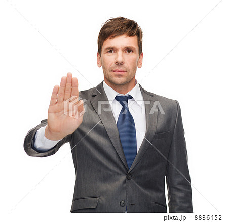 attractive buisnessman making stop gesture attractive buisnessman making stop gesture 8836452