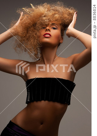 woman with long curly hair in crown woman with long curly hair in crown 8836814