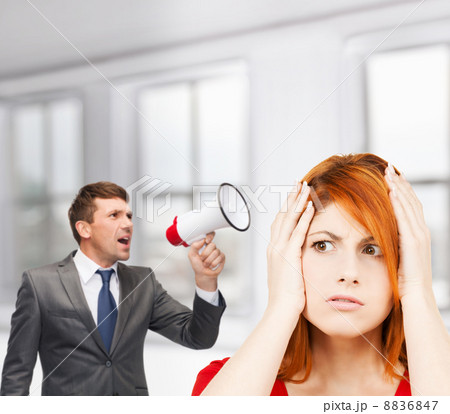 buisnessman with bullhorn and stressed woman 8836847