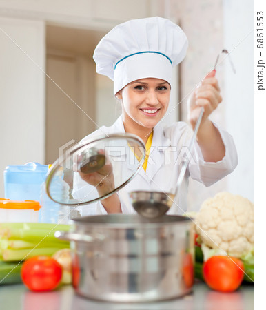 beautiful cook in toque prepares veggie lunch beautiful cook in toque prepares veggie lunch 8861553