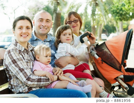 three generations family at summer park three generations family at summer park 8861956