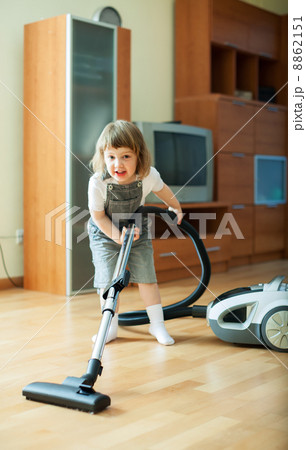 Baby girl with vacuum cleaner 8862151