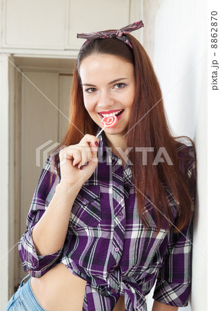 Pretty woman sucking lollipop 8862870