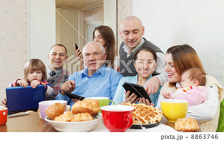 Happy family with electronic devices 8863746