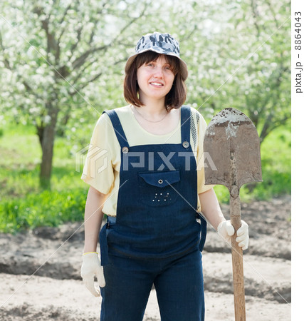 Female gardener with spade 8864043