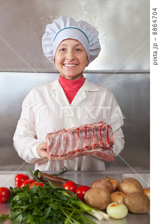 Cook woman with raw meat Cook woman with raw meat 8864704