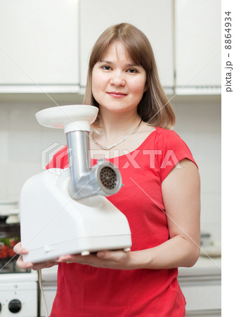 Woman with electric grinder 8864934