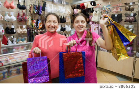 women with shopping bags in underwear shop women with shopping bags in underwear shop 8866305