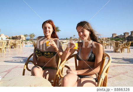 Girls relaxing with orange juice 8866326