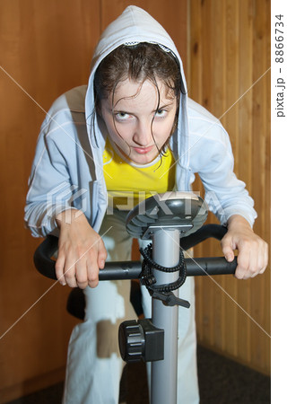 weariness girl on exercycle 8866734