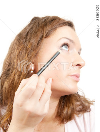 The girl puts mascara on with pen 8866929