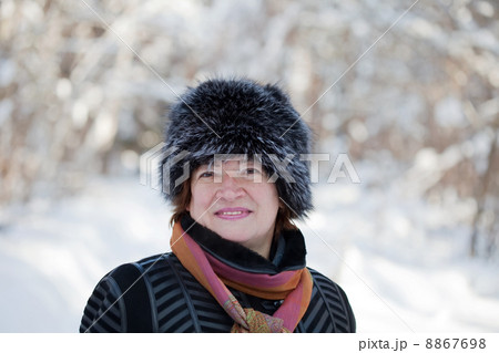 mature woman in wintry forest 8867698