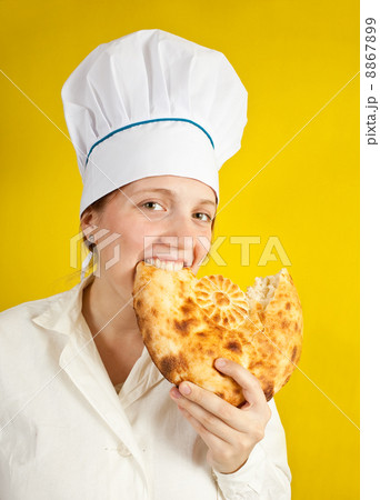 baker is eating fresh loaf baker is eating fresh loaf 8867899